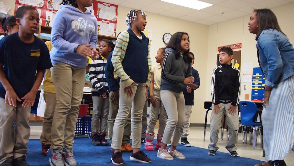 A group of students participating in a physical activity in class.